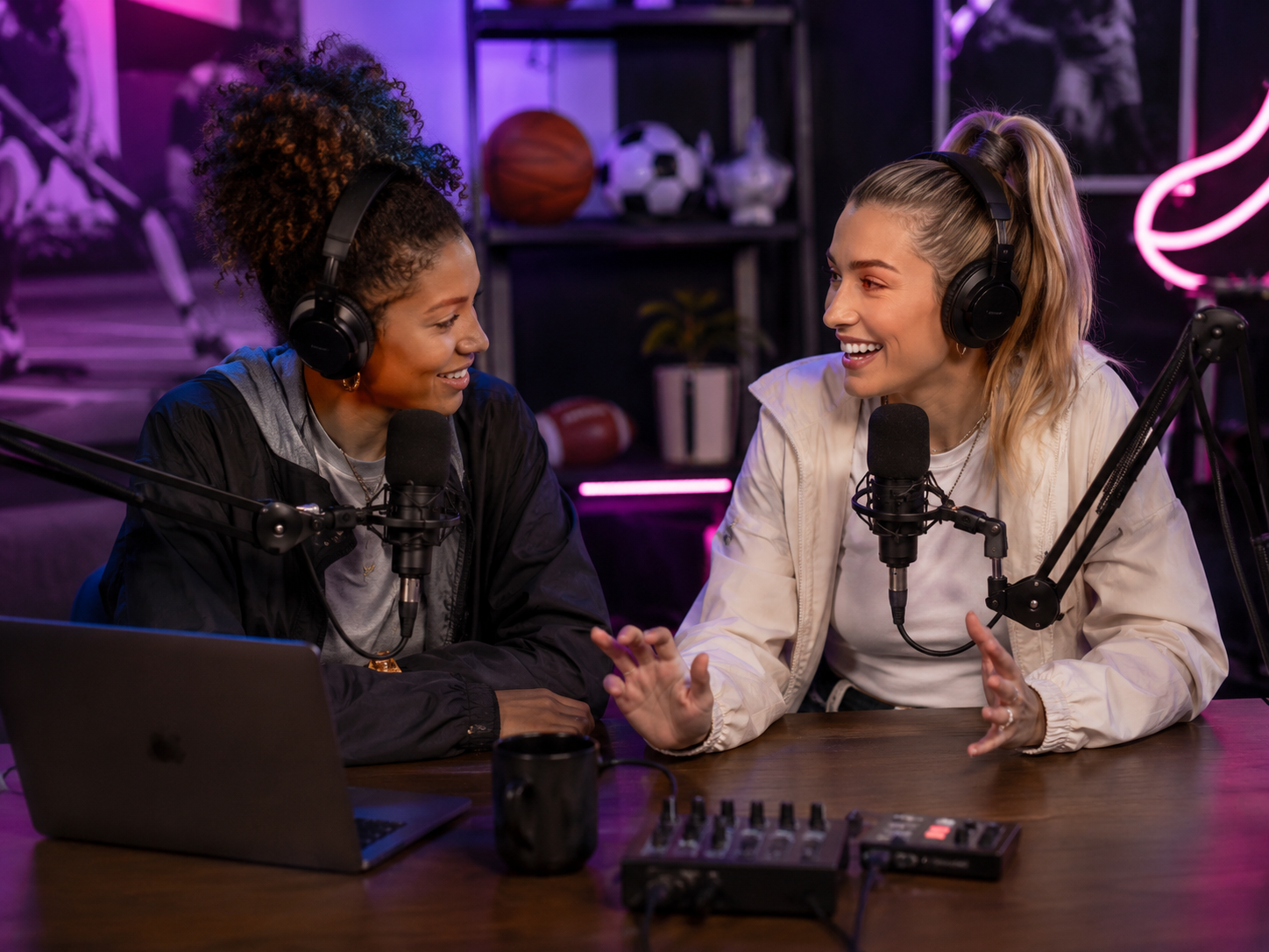 Two women recording a sports podcast together